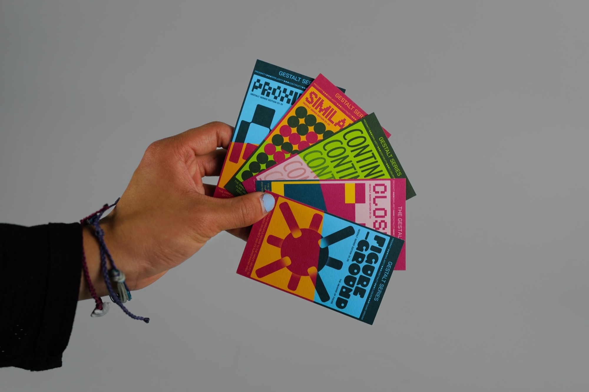 The Gestalt Series cards in hand
